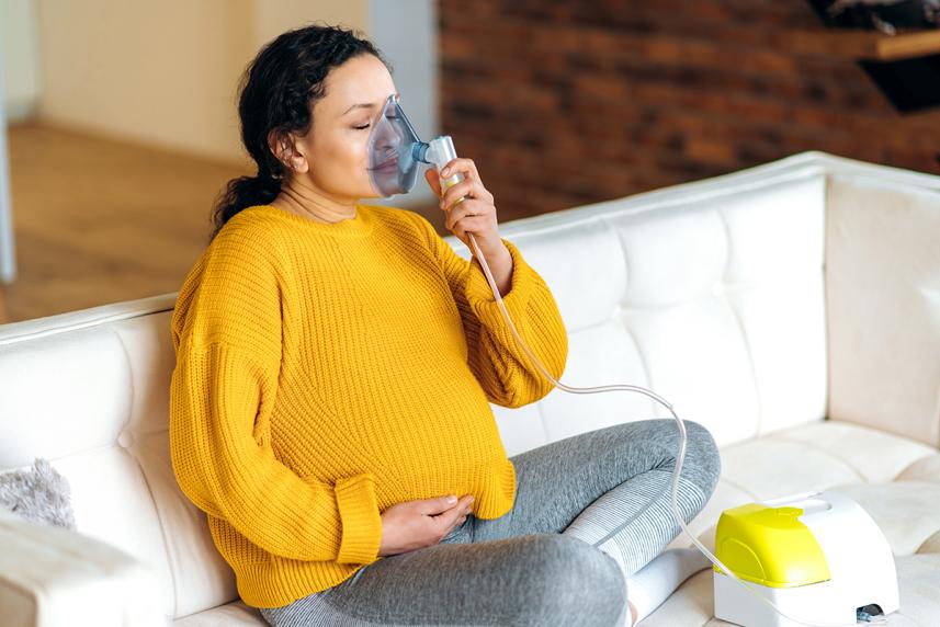 Pregnant woman with inhaler