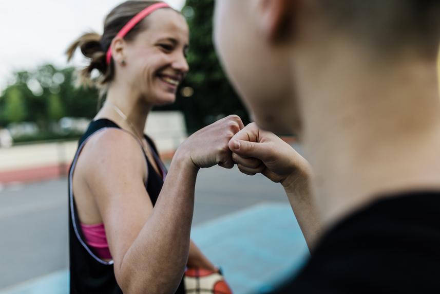 Woman fist-bumping