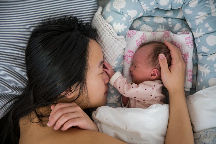 Mom cuddling with baby