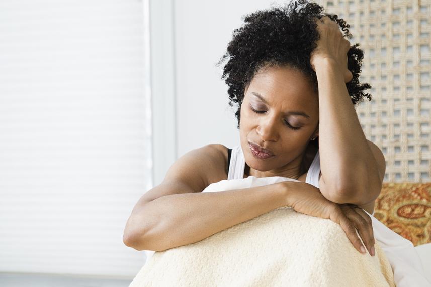 Woman sitting up in bed